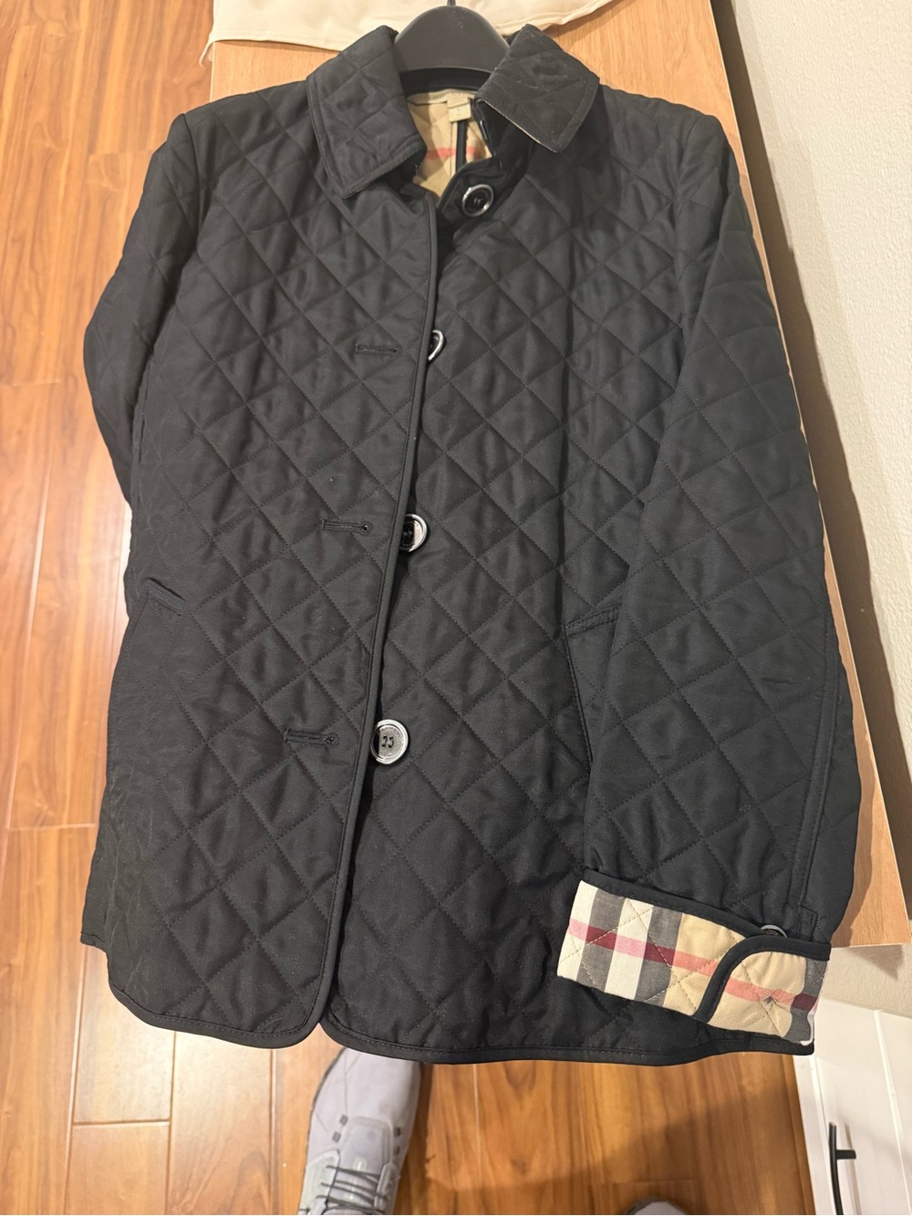 Burberry Black Quilted Jacket with Signature Check Cuff Detail Like new.